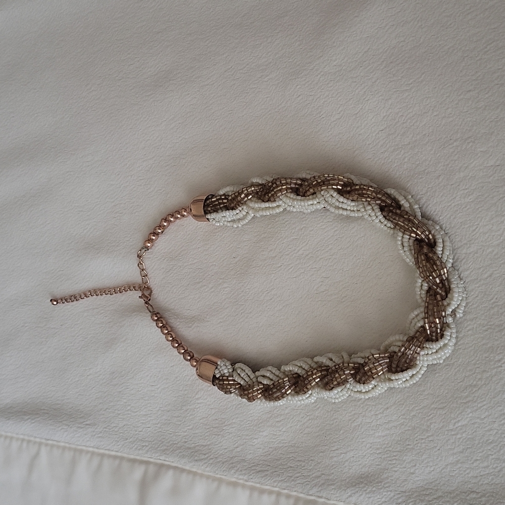 White and gold head necklace